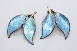 A PAIR OF DAVID ANDERSON NORWEGIAN SILVER GILT AND BABY BLUE ENAMEL LEAF DESIGN CLIP ON EARRINGS.