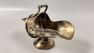 A WHITE METAL SUGAR CHUTE, THE BASE MARKED C W S IN SHIELD 8571.