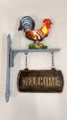 (R) COCK WELCOME SIGN.