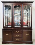 A MODERN DARK STAINED CHINA DISPLAY CABINET WITH DRAWERS AND CUPBOARDS TO BASE BY J E COYLE LTD