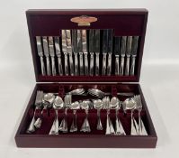 A COOPER LUDLAM PART CANTEEN IN A FITTED CASE.