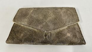A VINTAGE WHITE METAL BROCADE LADIES CLUTCH BAG.