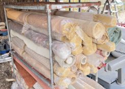 LARGE QUANTITY PART ROLLS OF UPHOLSTERY MATERIAL.