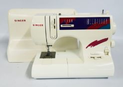 A SINGER SEWING MACHINE COMPLETE WITH FOOT PEDAL (NO CABLE) - SOLD AS SEEN.