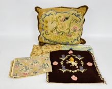 AN ANTIQUE EMBROIDERED CUSHION,