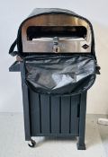 A CASA MIA GAS PIZZA OVEN WITH STAND, COVER AND PEEL.