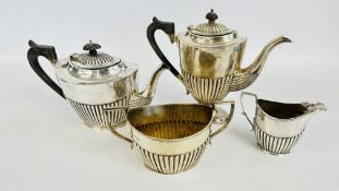 AN ANTIQUE SILVER 4 PIECE MATCHED TEA SET COMPRISING COFFEE POT AND TWO HANDLED SUGAR BASIN,