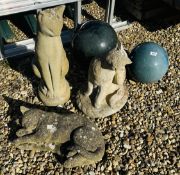 A GROUP OF THREE STONEWORK GARDEN CAT FIGURES, THE TALLEST 60CM AND TWO GLAZED GARDEN SPHERES.