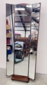 A MODERN CHEVAL MIRROR WITH FOLDING MIRRORED SIDE PANELS.