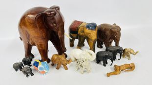 A GROUP OF HARD STONE AND CARVED WOODEN ELEPHANTS,