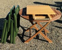 A TEAK FOLDING GARDEN TABLE WITH CIRCULAR TOP,