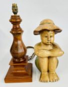 A MODERN MAHOGANY FINISH LAMP BASE AND A CARVED ORIENTAL SEATED FIGURE, H 36CM.