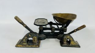 TWO VINTAGE CAST LETTER EMBOSSED PRESSES ALONG WITH A SET OF VINTAGE KITCHEN SCALES.