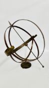 A METAL CRAFT SPHERE.