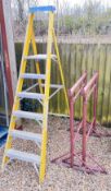 A SET OF YOUNGMAN FOLDING SIX TREAD FIBRE GLASS STEPS ALONG WITH TWO ADJUSTABLE BUILDERS TRESTLES.