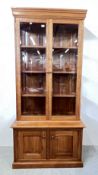 A GOOD QUALITY CHERRYWOOD GLAZED DISPLAY CABINET WITH CUPBOARD BASE, W 97CM X D 50CM X H 205CM.
