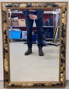 A GOOD QUALITY WALL MIRROR WITH BEVELLED GLASS AND FLORAL DETAIL, W 64CM X H 88CM.