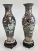 AN IMPRESSIVE MATCHED PAIR OF CHINESE PORCELAIN QING DYNASTY PERIOD VASES OF ELONGATED BALUSTER