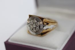 A 9CT GOLD TWO COLOUR MULTI DIAMOND GENTLEMAN'S RING.