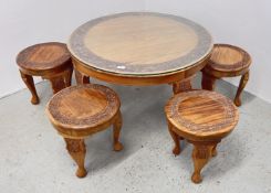 A CIRCULAR HARD WOOD COFFEE TABLE WITH CARVED DETAIL,