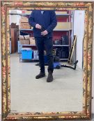A LARGE AND IMPRESSIVE WALL MIRROR WITH BEVELLED GLASS AND FLORAL DETAIL, W 93CM X H 125CM.