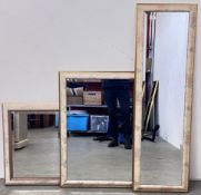 A GROUP OF 3 WALL MIRRORS WITH BEVELLED GLASS AND FLORAL DETAIL, RECTANGULAR 41CM X 132CM.