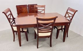 A MODERN MAHOGANY FINISH EXTENDING DINING TABLE WITH 4 DINING CHAIRS - MARKED CONDITION.
