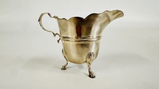 A SILVER CREAM JUG, LONDON RUBBED MARKS, H 7.5CM.