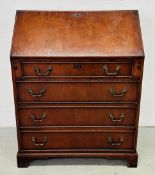 A REPRODUCTION MAHOGANY FOUR DRAWER FALLING FRONT WRITING BUREAU.