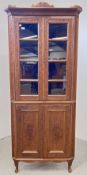 A HEAVILY CARVED HARD WOOD FLOOR STANDING CORNER CABINET WITH CUPBOARDS TO BASE, W 80CM, H 190CM.