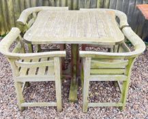 A HARD WOOD GARDEN DINING SET COMPRISING TABLE, 97CM X 97CM AND FOUR MATCHING CHAIRS.
