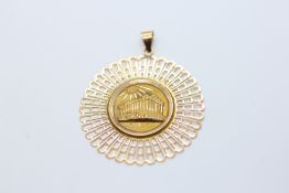 A MIDDLE EASTERN GOLD CIRCULAR PENDANT, THE CENTRE DEPICTING A TEMPLE, THE LOOP MARKED K14.