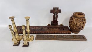 A CARVED WOODEN VASE AND A COAT HOOK ALONG WITH TWO PAIRS OF BRASS CANDLESTICKS.