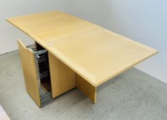 A MODERN SPACE SAVING FOLDING DINING TABLE WITH PULL OUT STORAGE.