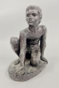 A KARIN JONZEN BOY ATHLETE KNEELING SCULPTURE.