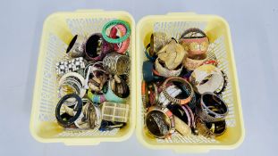 TWO BASKETS CONTAINING AN EXTENSIVE GROUP OF ASSORTED BANGLES TO INCLUDE CUFF,