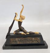 A COMPOSITION AND METAL DANCER KNEELING WITH HER RIGHT HAND ALOFT,