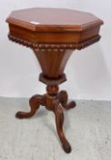 REPRODUCTION ORNATELY CARVED TRUMPET SEWING TABLE WITH HINGED TOP, HEIGHT 70CM.