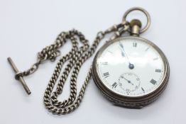 AN ANTIQUE SILVER CASED POCKET WATCH & CHAIN MARKED W.J. CARROLL LONDON.