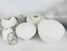 A GROUP OF VINTAGE GLASS SHADES TO INCLUDE MILK GLASS, FROSTED AND CLEAR GLASS EXAMPLES.