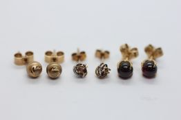 THREE PAIRS OF 9CT GOLD STUD EARRINGS TO INCLUDE A PAIR OF TRI-COLOURED KNOT EXAMPLES.
