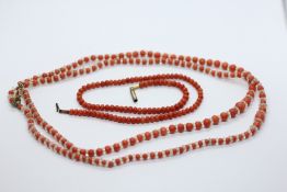 A GEORGIAN CORAL NECKLACE + A FURTHER ANTIQUE CORAL DOUBLE STRAND NECKLACE.