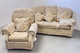 A FLORAL UPHOLSTERED TWO PIECE LOUNGE SUITE COMPRISING OF A THREE SEATER SOFA,