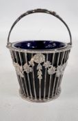 A SILVER OPEN WORK BASKET WITH BLUE GLASS LINER, LONDON 1965, MAKER C J VANDER LTD.