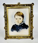 A RECTANGULAR PORTRAIT OF A BOY IN DARK BLUE COAT AND WHITE COLLAR; IN SILVER COLOURED METAL FRAME.
