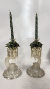 A PAIR OF CLEAR GLASS AND PART FROSTED CANDLE LUSTRES WITH TULIP NOZZLES AND WRYTHEN DRIP PANS