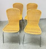 A SET OF 4 WICKER CHAIRS SUPPORTED ON A METAL FRAME.