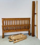 AN OAK FURNITURE LAND RUSTIC SOLID OAK KING SIZE BED FRAME.