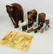 A GROUP OF HARD STONE AND CARVED WOODEN ELEPHANTS,