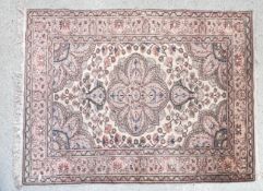 VINTAGE CREAM AND RED PATTERN RUG.